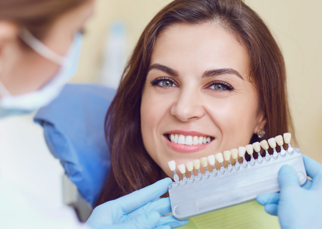 The dentist showing a dental veneers to her patient for Dental Crowns in Mississauga, ON
