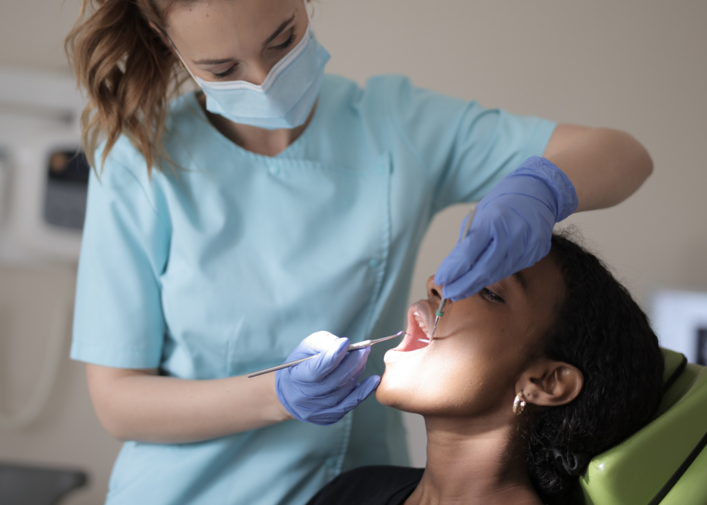 A female patient and her dentist during Onyx Dental Restorative Dentistry in Mississauga
