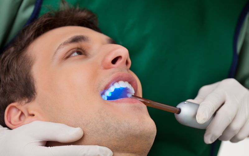 dentist with uv light