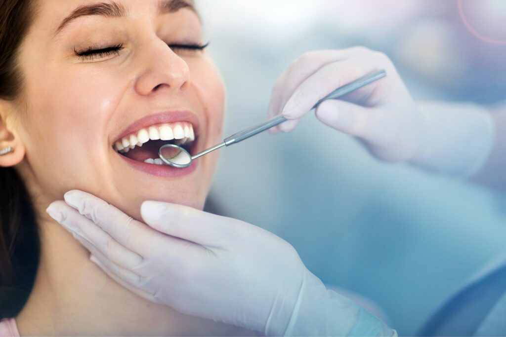 woman having teeth examined dentists